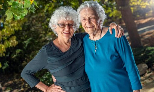 Two smiling elderly women