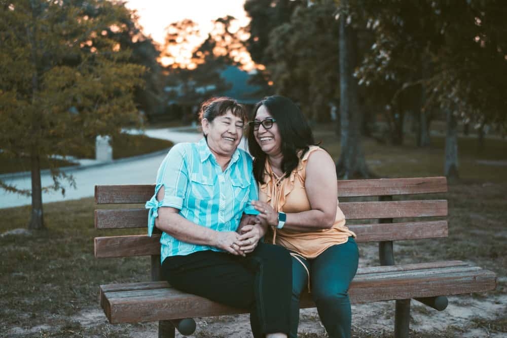 Two women sitting on bench